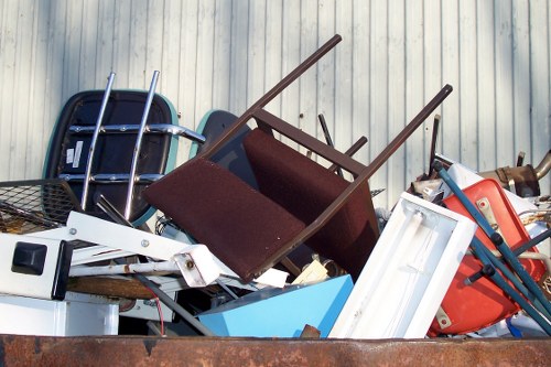 People disposing of old furniture in Harrow